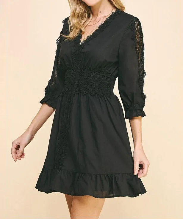 Lace trim black mini dress.