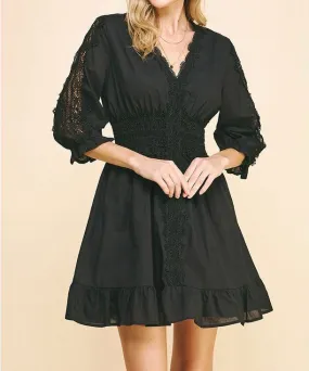 Lace trim black mini dress.