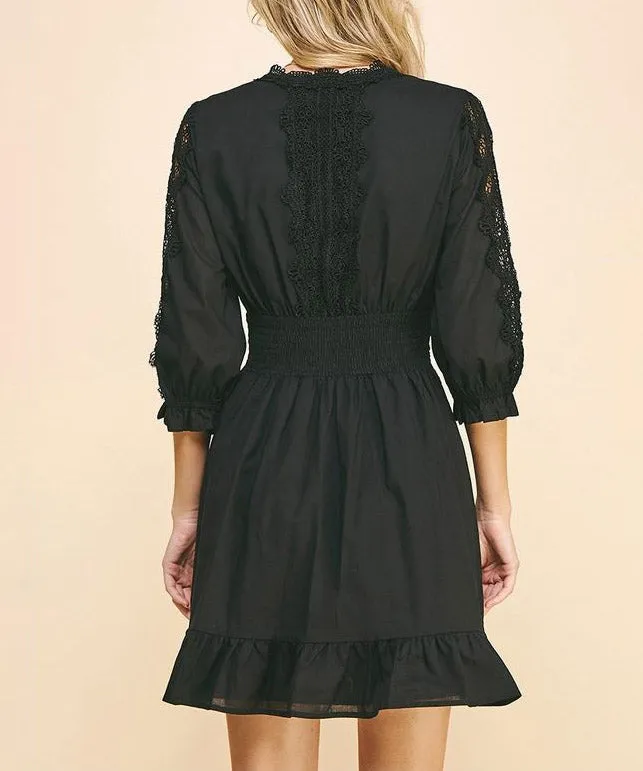 Lace trim black mini dress.