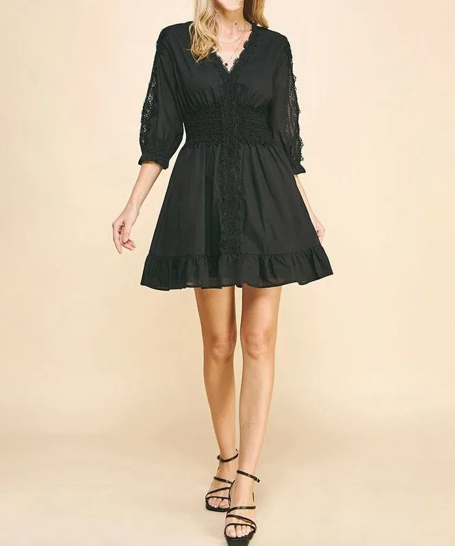 Lace trim black mini dress.